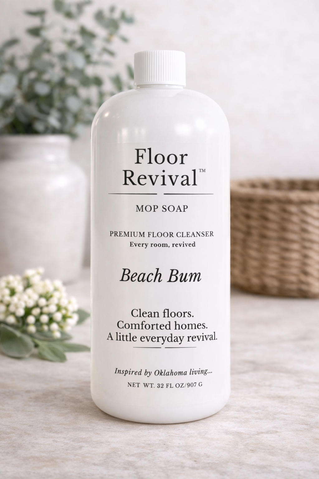 Beach Bum Floor Revival mop soap bottle on neutral countertop – luxury home floor cleaner inspired by Oklahoma living.