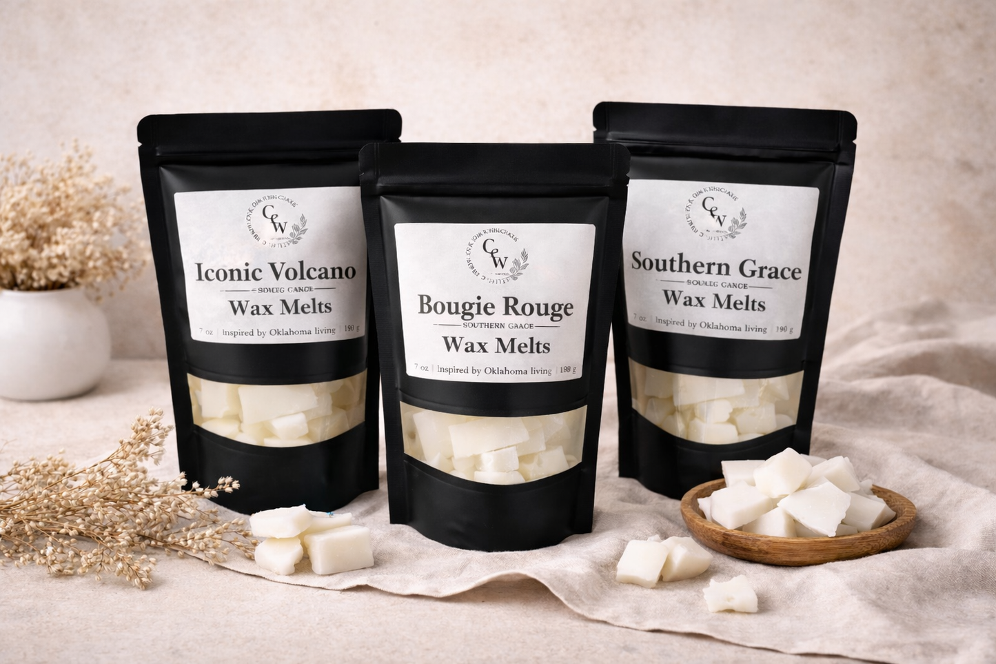Three packages of wax melts labeled 'Iconic Volcano', 'Bougie Rouge', and 'Southern Grace' on a neutral background.