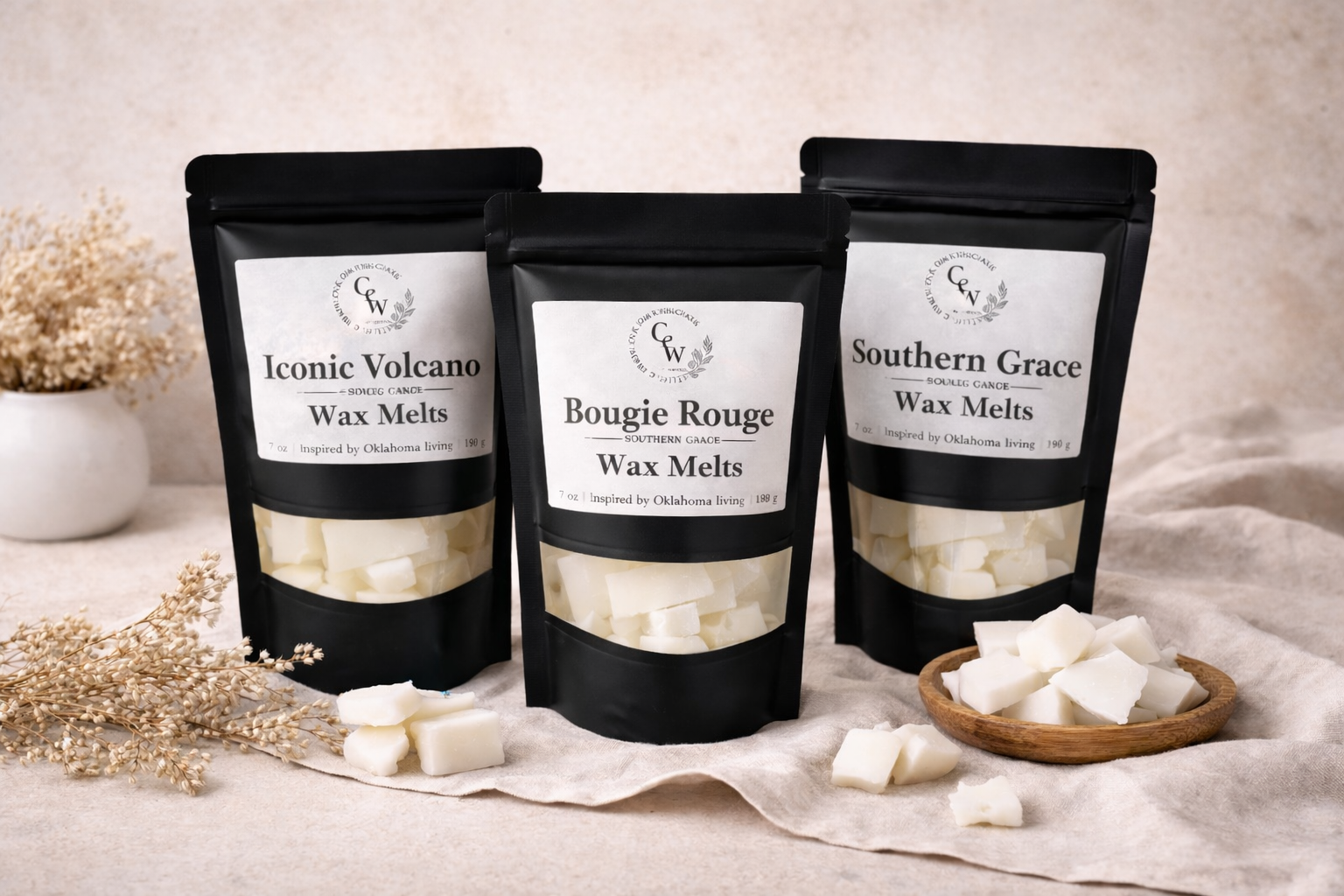 Three packages of wax melts labeled 'Iconic Volcano', 'Bougie Rouge', and 'Southern Grace' on a neutral background.