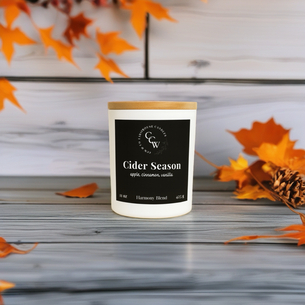 Cider Season candle by CCW & Co farmhouse candles, white cottage jar with wood lid, a comforting blend of crisp apple, warm cinnamon, and creamy vanilla that captures the cozy essence of fall gatherings.