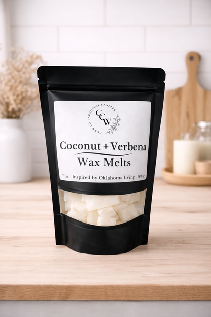 Black resealable pouch of Coconut + Verbena wax melts by CCW & Co Farmhouse Candles, featuring a white label and clear window showing hand-poured wax melts, styled on a neutral kitchen countertop.