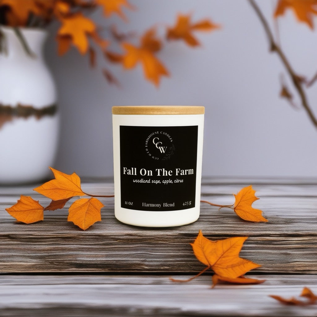Fall On The Farm candle by CCW & Co farmhouse candles, white cottage jar with wood lid, a refreshing blend of woodland sage, crisp apple, and bright citrus that captures the simple beauty of autumn days on the farm.