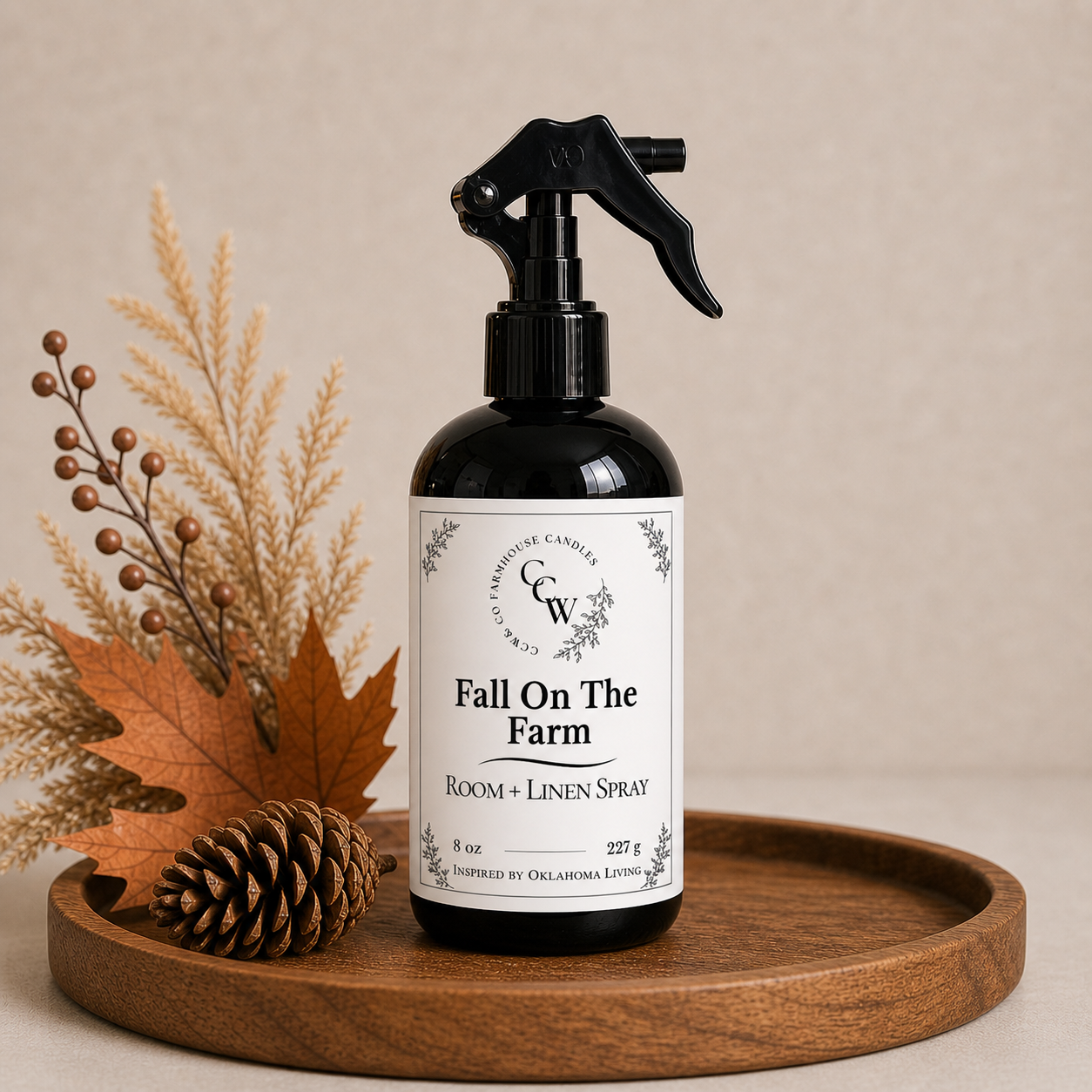 Fall On The Farm room and linen spray bottle on wooden tray with fall decor and neutral background