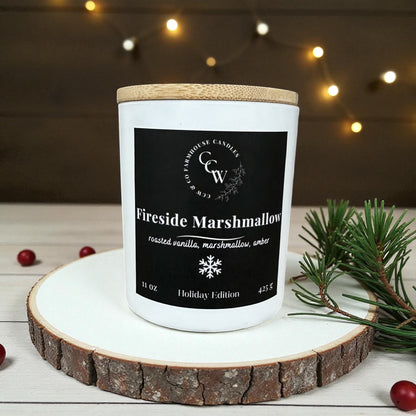 Fireside Marshmallow candle in a matte white cottage jar with wood lid, holiday scent of roasted vanilla, marshmallow, and amber.