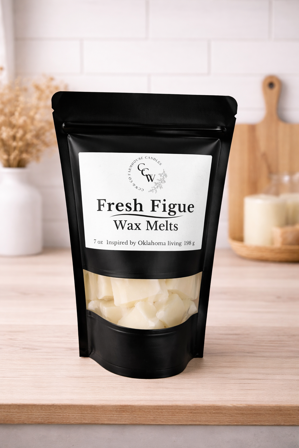Black resealable pouch of Fresh Figue wax melts by CCW & Co Farmhouse Candles, featuring a white label and clear window showing hand-poured wax melts, styled on a neutral kitchen countertop.