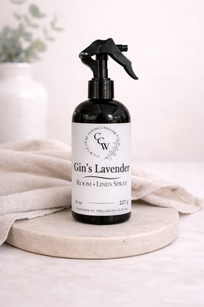 Gin's Lavender room and linen spray bottle on a light surface with a neutral background