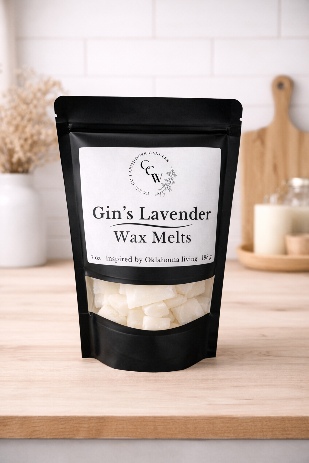 Black resealable pouch of Gin's Lavender wax melts by CCW & Co Farmhouse Candles, featuring a white label and clear window showing hand-poured wax melts, styled on a neutral kitchen countertop.