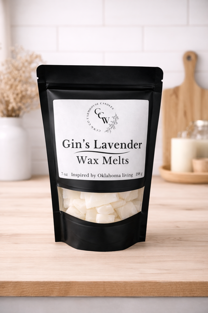 Black resealable pouch of Gin's Lavender wax melts by CCW & Co Farmhouse Candles, featuring a white label and clear window showing hand-poured wax melts, styled on a neutral kitchen countertop.