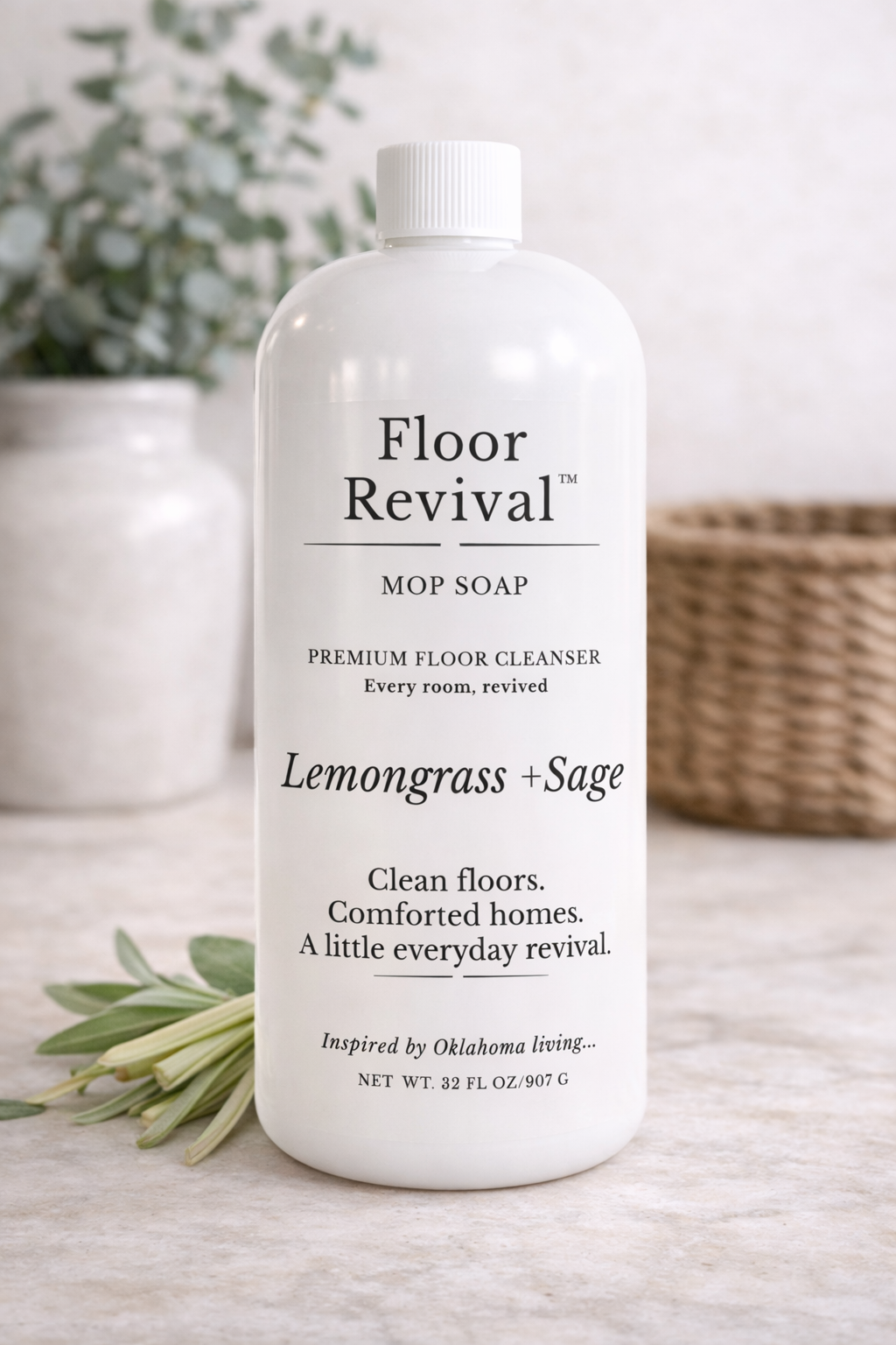 Lemongrass + Sage Floor Revival mop soap bottle on neutral countertop – luxury home floor cleaner inspired by Oklahoma living.
