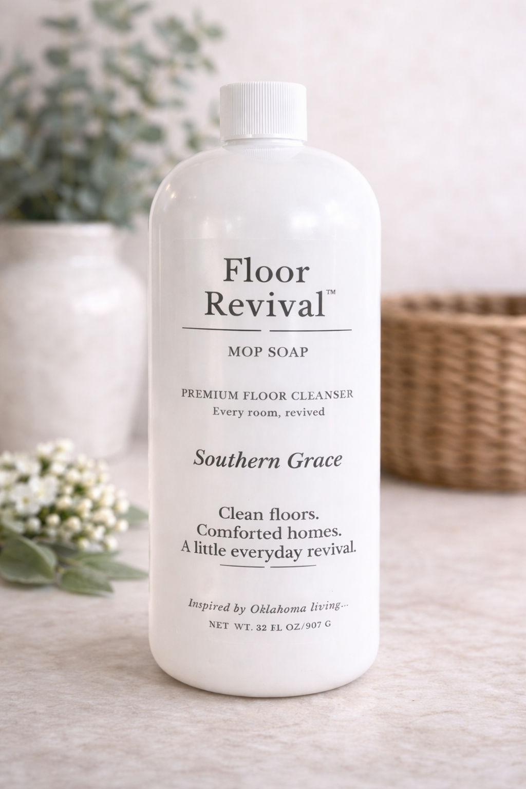 Southern Grace Floor Revival mop soap bottle on neutral countertop – luxury home floor cleaner inspired by Oklahoma living.