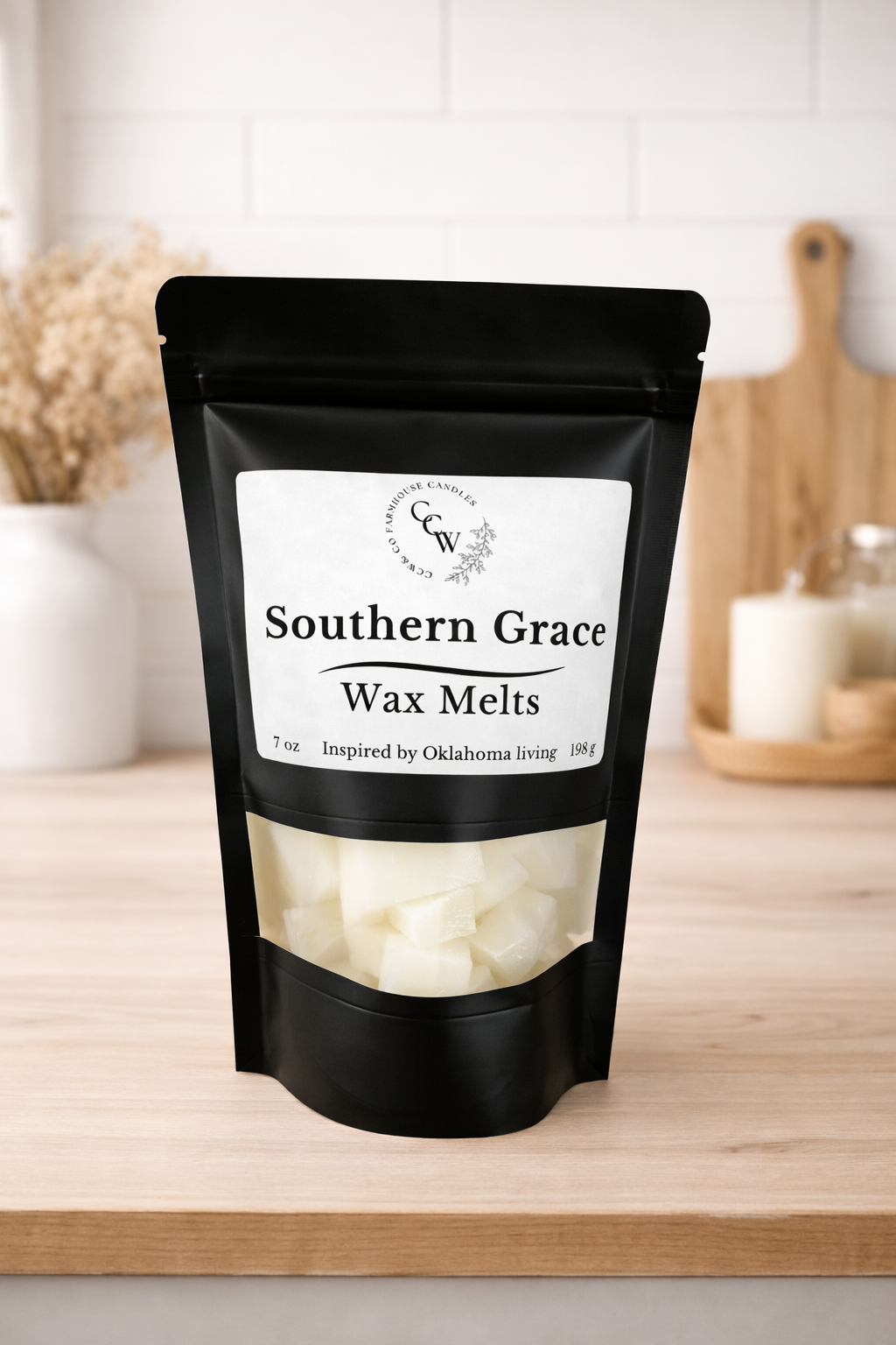 Black resealable pouch of Southern Grace  wax melts by CCW & Co Farmhouse Candles, featuring a white label and clear window showing hand-poured wax melts, styled on a neutral kitchen countertop.