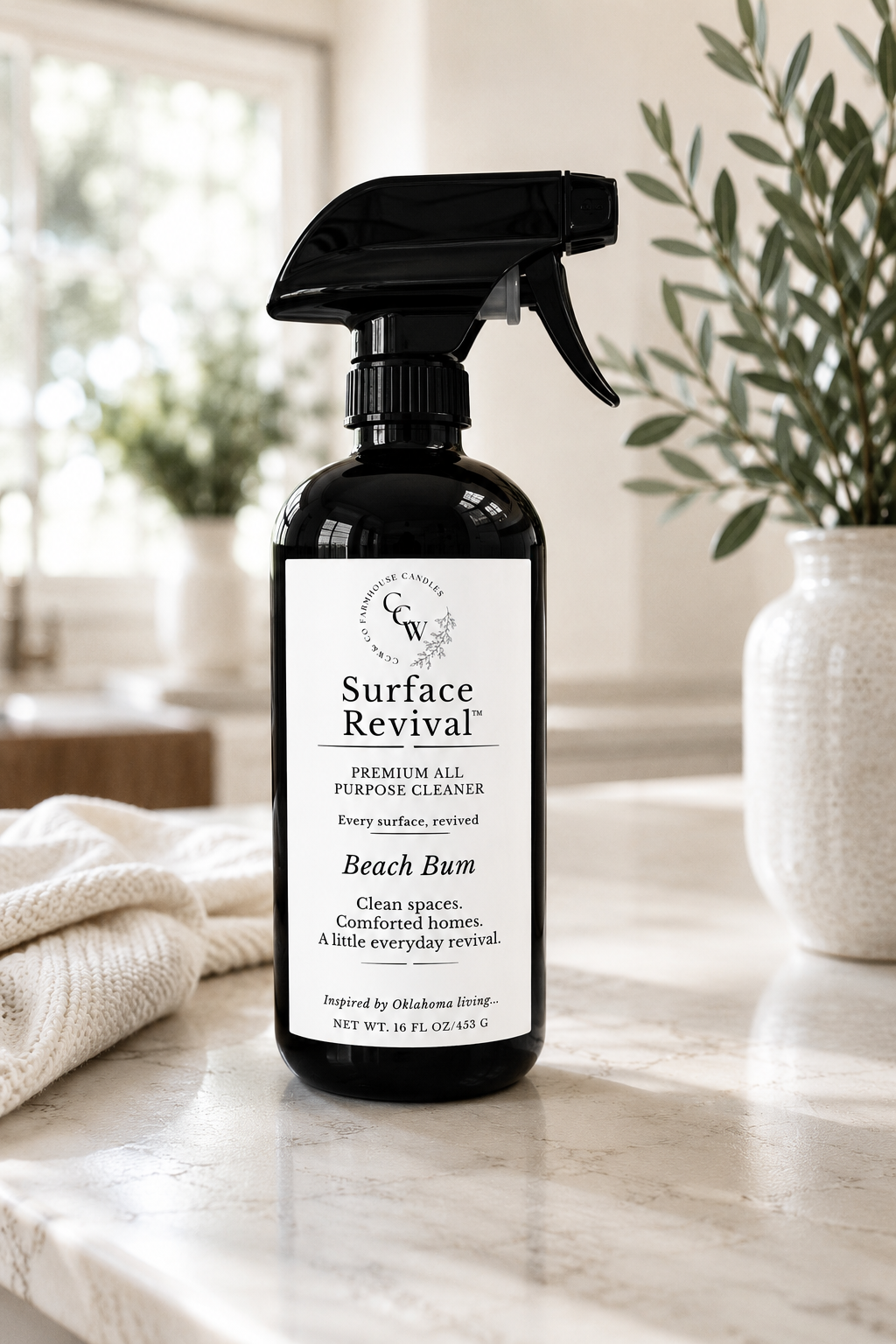 Surface Revival™ Premium All-Purpose Cleaner in Beach Bum fragrance displayed in a bright kitchen with soft natural light.