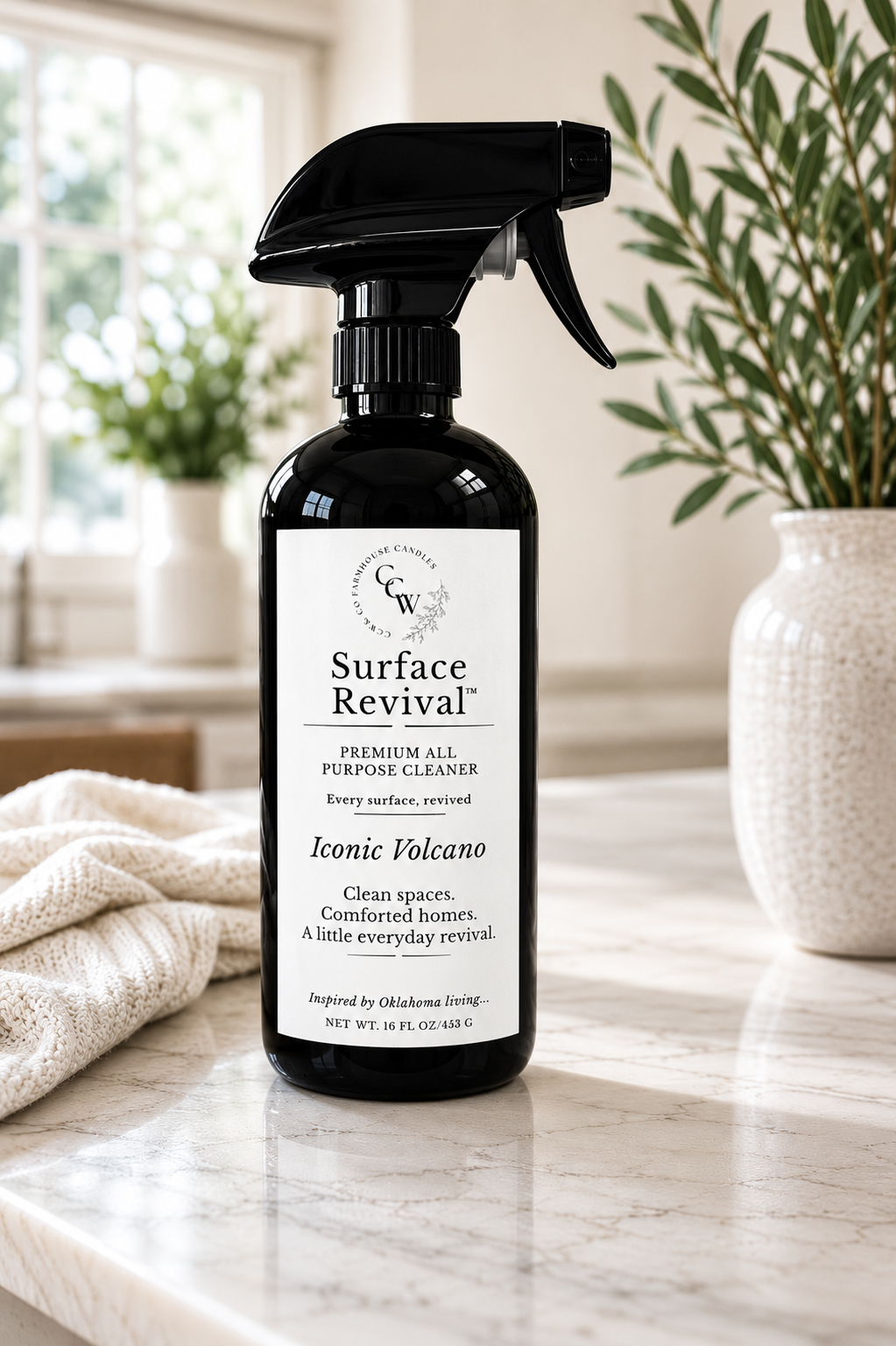 Surface Revival™ Premium All-Purpose Cleaner in Iconic Volcano fragrance styled on a marble countertop with natural light.