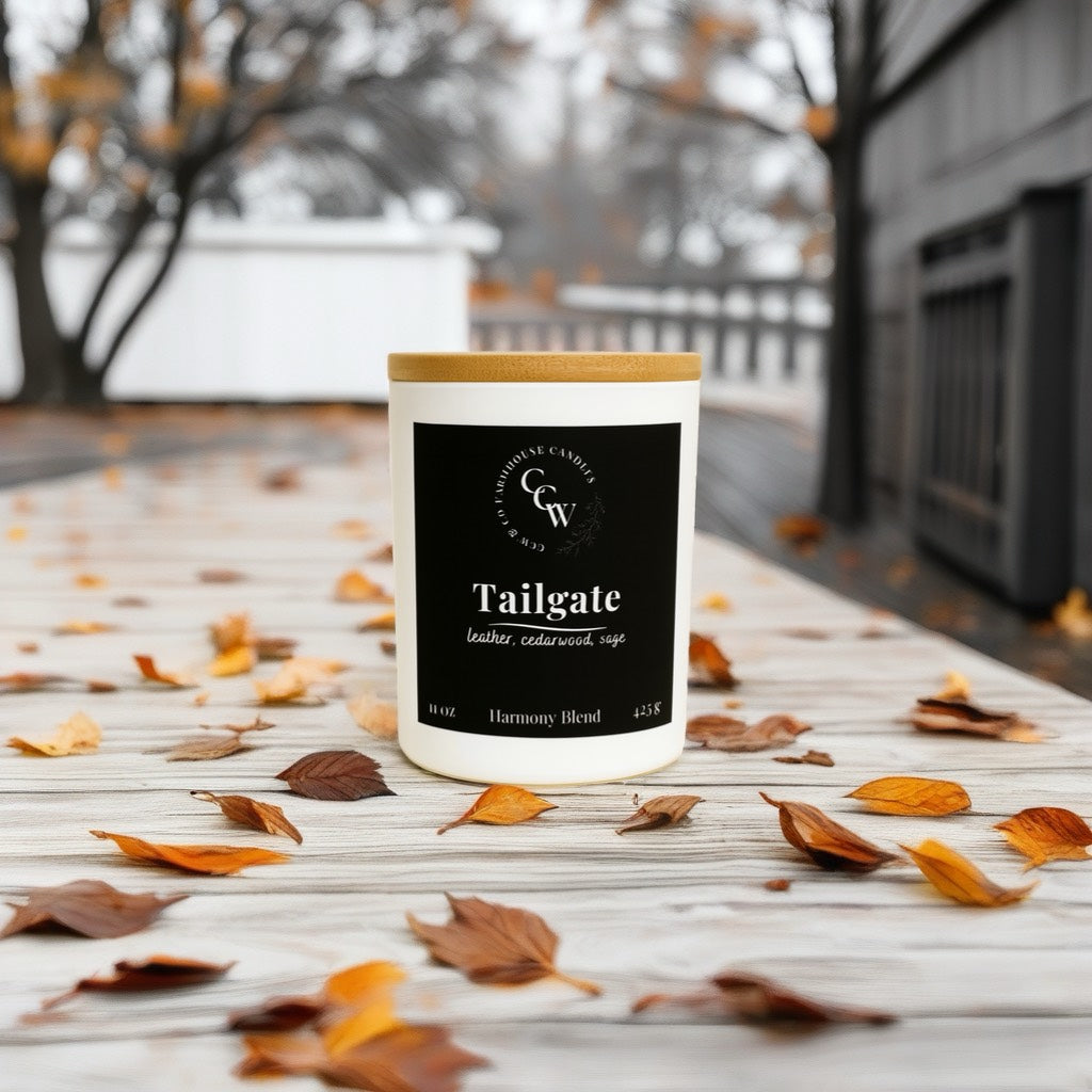 Tailgate candle by CCW & Co farmhouse candles, white cottage jar with wood lid, a rugged blend of leather, cedarwood, and sage that evokes cool nights, bonfires, and game-day gatherings under the stars.