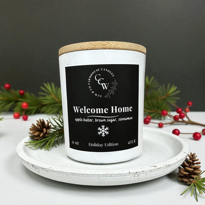 Welcome Home candle by CCW & Co farmhouse candles, white cottage jar with wood lid, holiday scent of apple butter, brown sugar, and cinnamon.