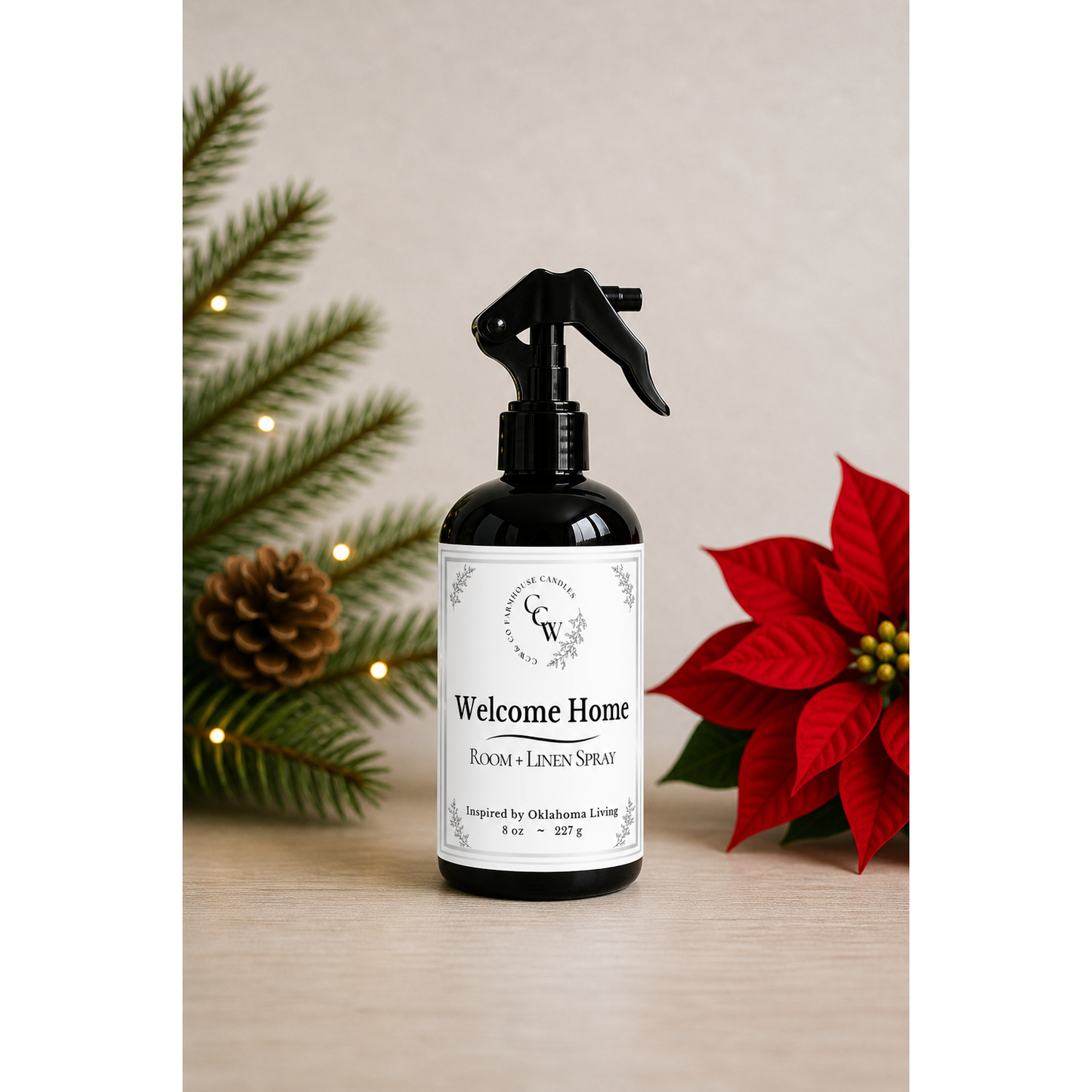 Welcome Home room + linen spray in black bottle with Christmas greenery and poinsettia – CCW Farmhouse home fragrance