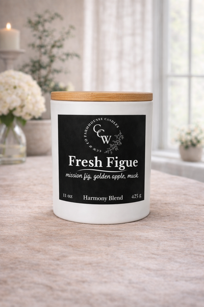 Fresh Figue candle by CCW & Co Farmhouse Candles in a white jar with wooden lid, styled on a neutral tabletop in soft natural light