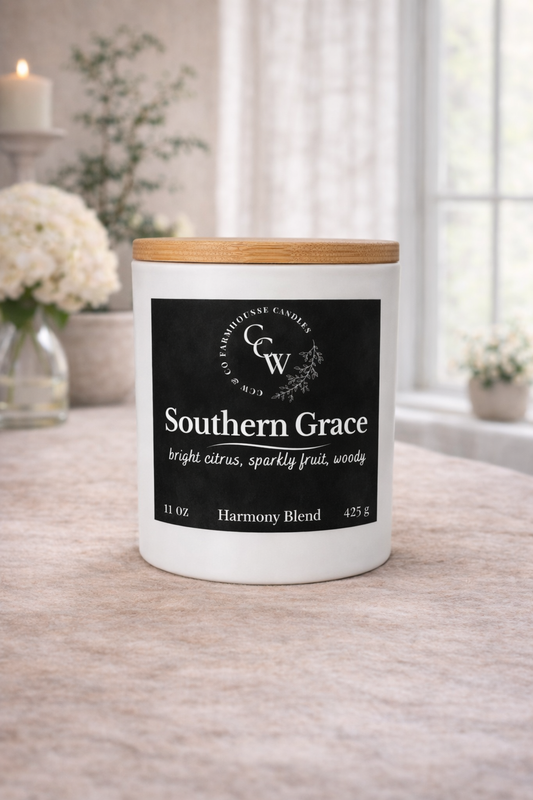 Southern Grace candle by CCW & Co Farmhouse Candles in a white jar with wooden lid, styled on a neutral tabletop in soft natural light